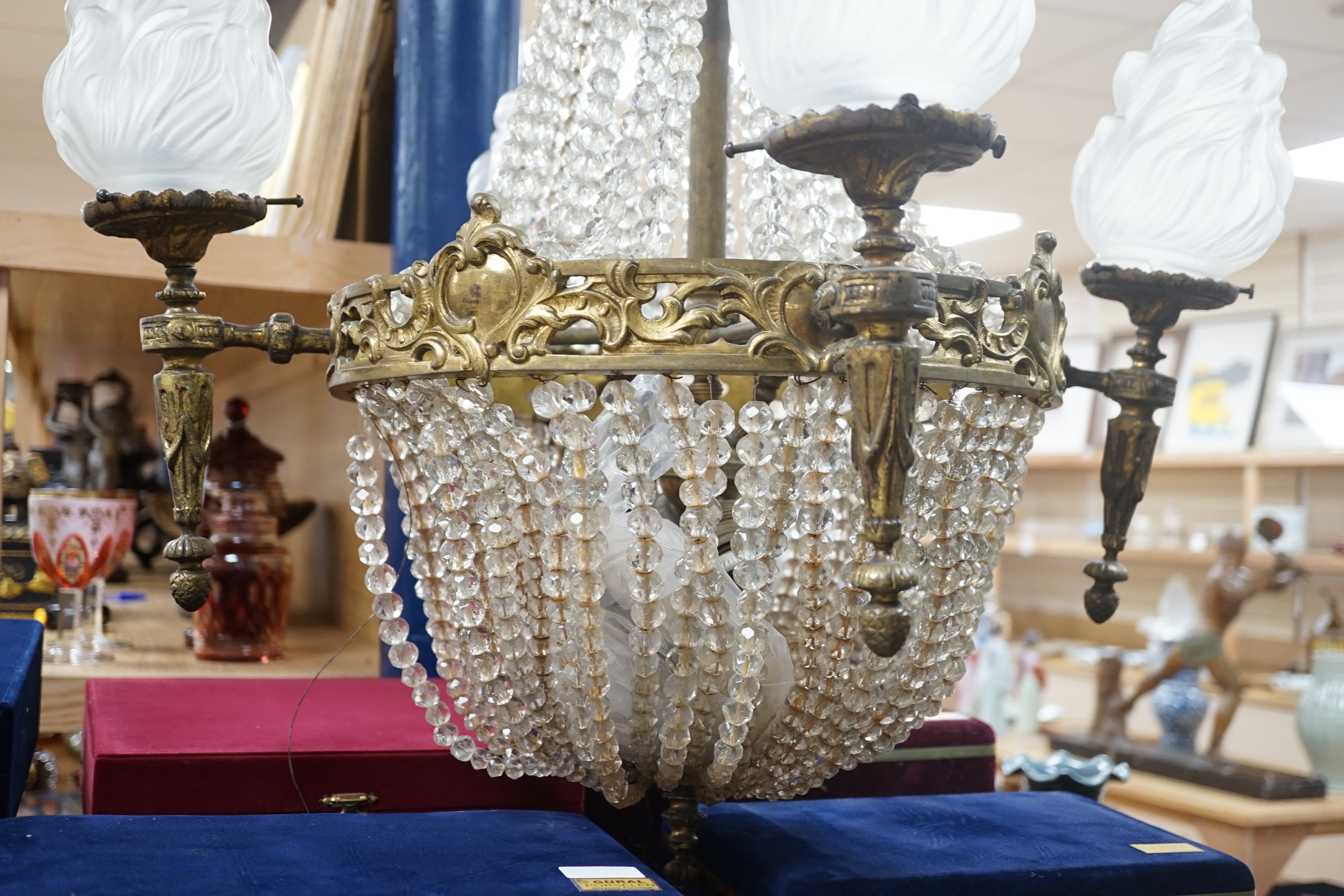 A French gilt Empire style cut glass and brass chandelier, 95cm high